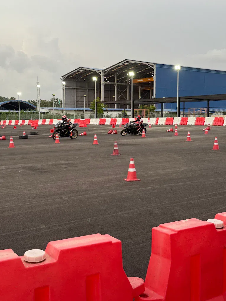 Riders training under floodlights on the EEST NJT mini circuit
