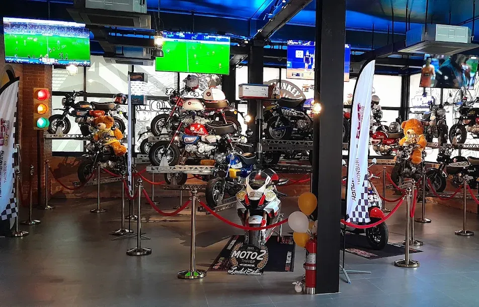 Honda Monkey minibikes on the gallery racks, teddy-bear passengers aboard