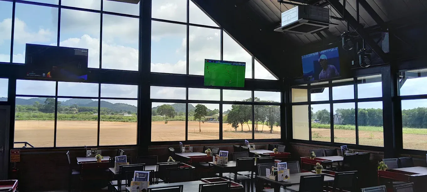 The restaurant dining floor, the circuit grounds through the glass wall